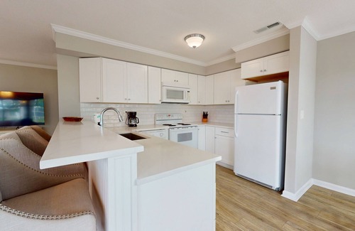 Fenwick Island Condo | East of Sun condo with water-view, on-site pool & tennis - near beach