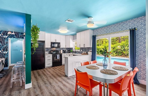 Garden Isles House | Eccentric home with pool, tiki hut & outdoor kitchen