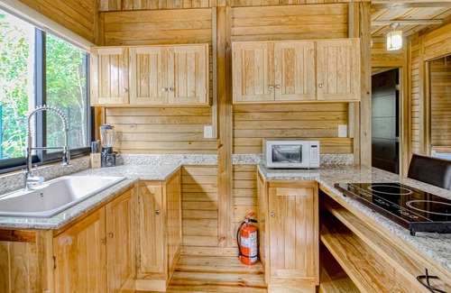 Tulum Cabin | Eco-luxe jungle cabin with furnished patio, lanai, partial AC, & on-site cafe