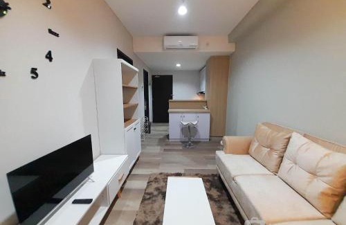 Mlati Apartment | Elegant and Spacious 1BR at Patraland Amarta Apartment By Travelio