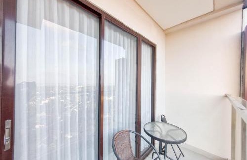 Mlati Apartment | Elegant and Spacious 1BR at Patraland Amarta Apartment By Travelio