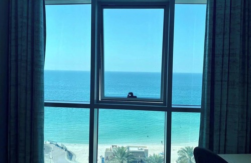 Rumailah Apartment | Elegant Beachfront Apartment with Sea Views
