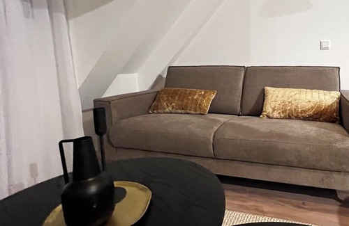 Goirle Apartment | Elegant stay with parking, WiFi, and contemporary furnishings near local shops. Sleeps four