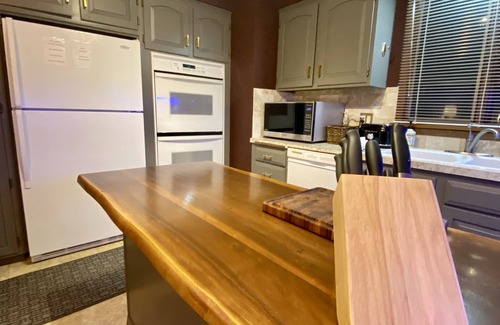 Fort Morgan House | Elegant Three Bedroom Home with Patio and Fireplace