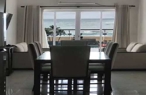 Mount Lavinia Apartment | Enjoy a beautiful sunset from your ocean-view bedroom.