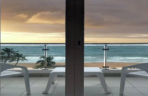 Mount Lavinia Apartment | Enjoy a beautiful sunset from your ocean-view bedroom.