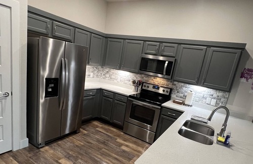 Lockhart House | Enjoy a game of a pool or a relaxing soak in the jacuzzi at the hangout!