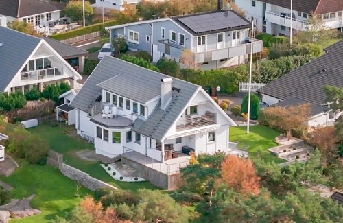 Vastra Frolunda House | Enjoy a wonderful view of the archipelago in this comfortable vacation home with sauna.