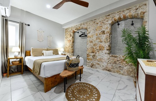 De Bruynewijk Resort | Escape to Eva Resorts in Savaneta, Aruba, a boutique luxury retreat with six unique apartments accommodating up to 14 guests. Just steps from turquoise waters, the resort features a saltwater pool, rooftop terraces with sunset views, and more.