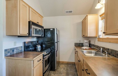 Dover Bay House | Escape to "Tranquility Base", a serene Dover Bay retreat just steps from the lake. Enjoy peaceful comfort, nature trails, and resort amenities.