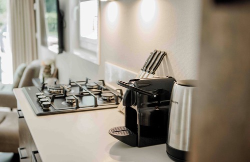 Lieren House | Experience luxury and nature in the Tiny Lodge in the Veluwe! With 2 bedrooms, a fully equipped kitchen, and air conditioning.