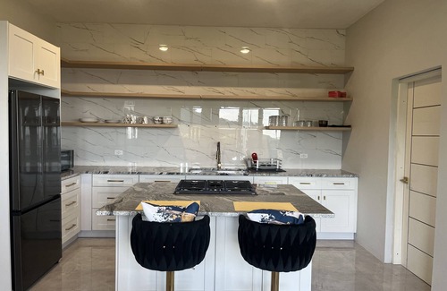 Road Town House | Experience Tranquility with Breathtaking Hillside Views overlooking Nanny Cay