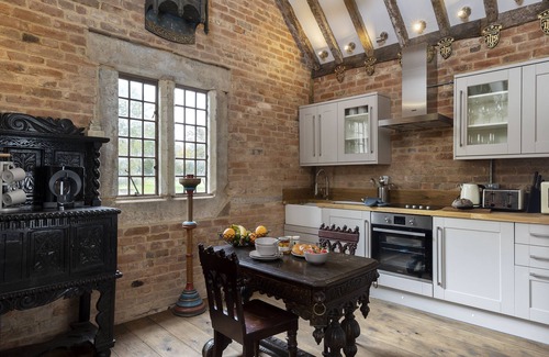 Bromsgrove Apartment | Exposed timbers, a feature stone fireplace, flagstone and oak floors – The Chapel has a wealth of pe