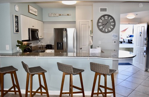 Upper Grand Lagoon Condo | FALL BREAK DEALS PLUS GULF VIEWS, BEACH CHAIR SERVICE AND PREMIER PARKING!