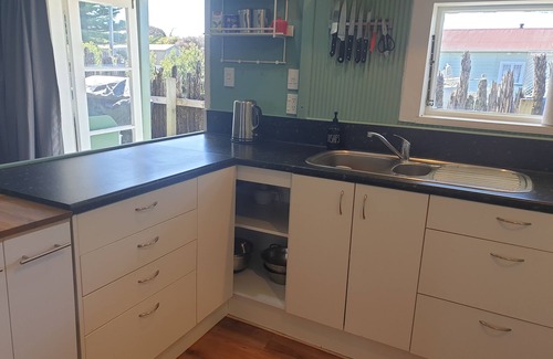 Hokio Beach House | Family friendly and pet friendly. A kiwi bach holiday at Hōkio Beach.