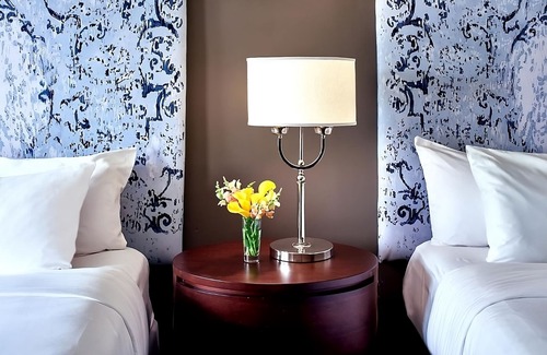 West Plaza Hotel | Family Getaway! 2 Spacious Units, Pool, Pets Allowed Near Rockhurst University!