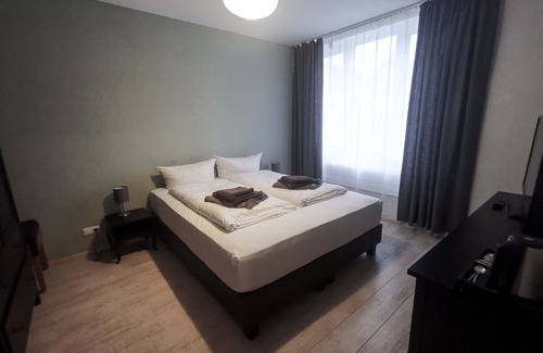 Neumuenster House | Family room with two separate bedrooms