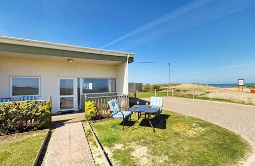 Bacton Cottage | Fantastic chalet located alongside the beach.