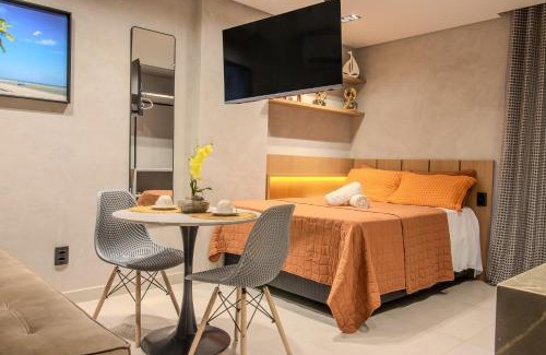 Jardim Oceania Apartment | Flat a 50m da praia, com cozinha completa, estacionamento, recepção 24h, academia, lavanderia, Wi-Fi, mini mercado, Rooftop com piscina, churrasqueira e vista incrível