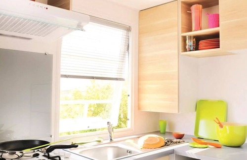 Treignac House | Flower Camping La Plage * - Mobile home Comfort 29m2 (2 bedrooms) + TV + semi-covered terrace 18m2 6 people