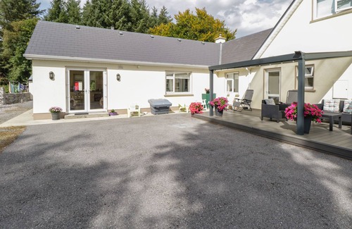 Milltown Cottage | FOREST HOUSE, romantic, with open fire in Tuam, County Galway