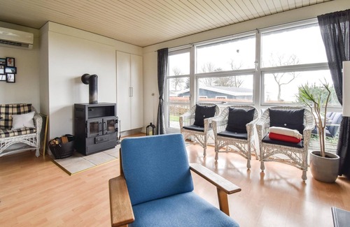 Mesinge House | From this cottage you have a fantastic view over the sea and to Enebær Odde with its characteristic