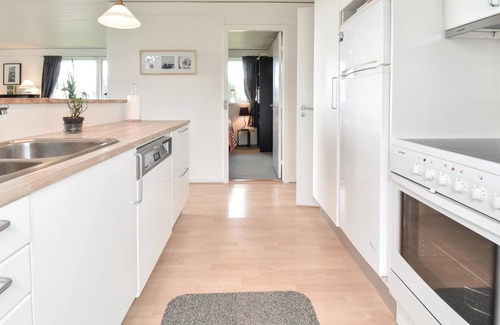Mesinge House | From this cottage you have a fantastic view over the sea and to Enebær Odde with its characteristic