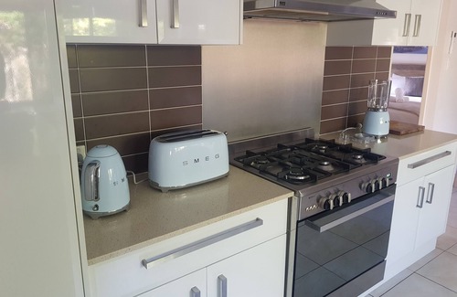 Mudjimba House | Fully Equipped Luxe Beach Retreat, Pool, Pet Friendly, 2 Living Areas & AirCon