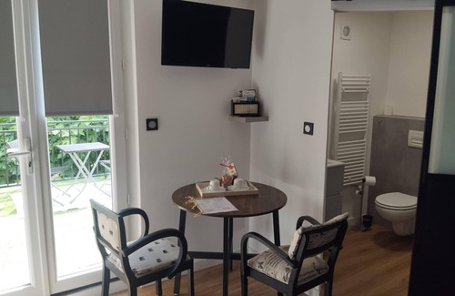 Journiac Bed & Breakfast | Garden side, guest room and private terrace with wooded view