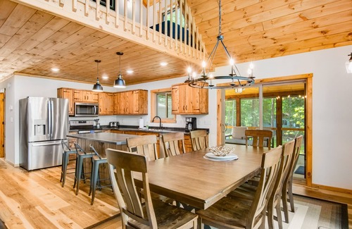 Eagle River House | Gorgeous lake home with private pier, beach, firepit, deck, & grill + water toys