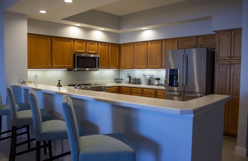 Burnt Store Marina Condo | GRAND ISLES III, 5th Floor Condo w/an AMAZING SUNSET VIEW in a Tropical Setting