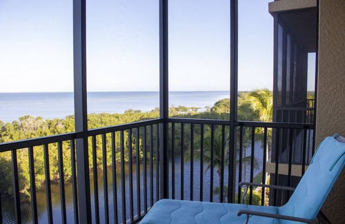 Burnt Store Marina Condo | GRAND ISLES III, 5th Floor Condo w/an AMAZING SUNSET VIEW in a Tropical Setting