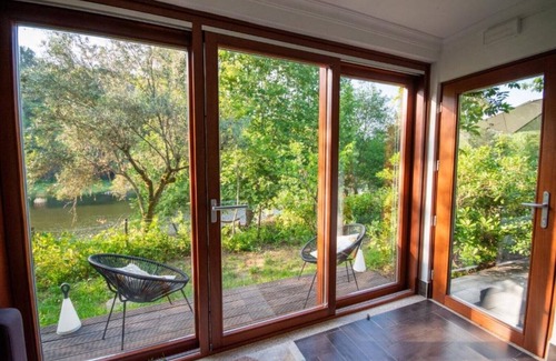 Currelos Apartment | Granite-wall Luxury Cave on the Mondego River