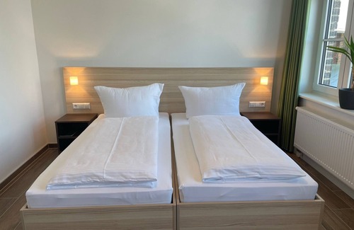Pasewalk Bed & Breakfast | Guest house apartment 107 - Lokschuppen Pasewalk- Guest houses with double rooms, single rooms and