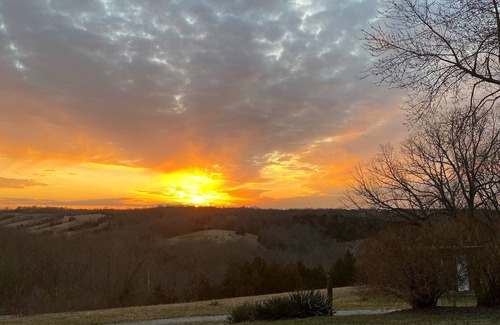 Carlisle House | Hilltop Farmhouse with sunrise sunset porch overlooking hills and holler