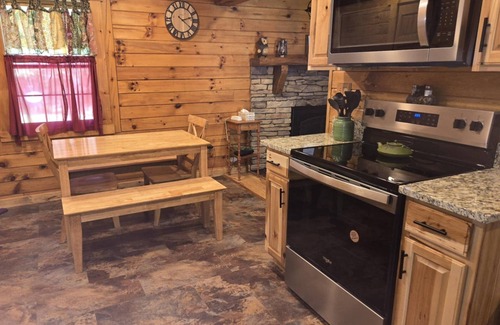 Rockbridge Cabin | Hocking Hills Log Cabin in the Woods facing Rock formation