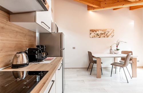 Musso Apartment | Holiday Apartment "Orchidea Terrazzo Sul Tetto" with Balcony, Shared Pool & Wi-Fi