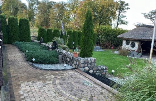 Lubna House | Holiday Home by Lake in Nowa Wioska