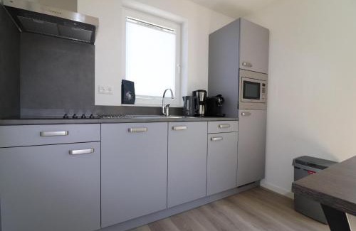 Municipality of Nissewaard House | Holiday Home by Lake Beach Simonshaven