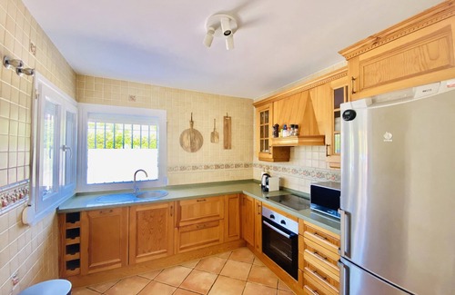 Manilva House | Holiday Home 'Happy Beach House' next to the beach with Terrace, Shared Pool & Wi-Fi