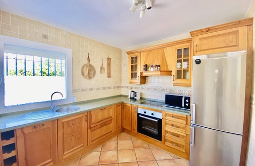 Manilva House | Holiday Home 'Happy Beach House' next to the beach with Terrace, Shared Pool & Wi-Fi