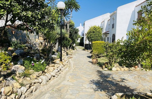 Manilva House | Holiday Home 'Happy Beach House' next to the beach with Terrace, Shared Pool & Wi-Fi