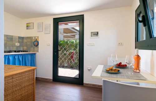 Maruggio House | Holiday Home 'L'angolodelsole Melina' with Shared Pool, Wi-Fi and Air Conditioning