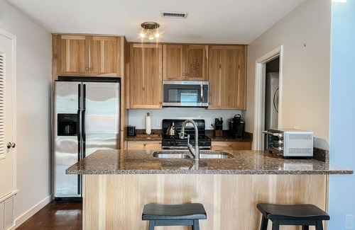 St. Edwards Apartment | Home away from home triplex two bedroom with office