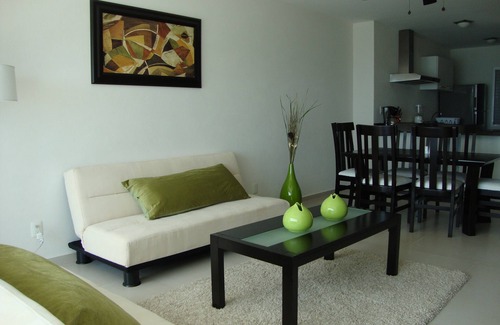 Puerto Juarez Apartment | HOME OFFICE?.ENJOY IT AT CANCUN, AFFORDABLE NICE BEACHFRONT CONDO.
