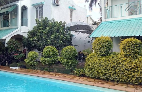 Flic-en-Flac House | Homerez - Spacious House in Flic en Flac with Shared Pool
