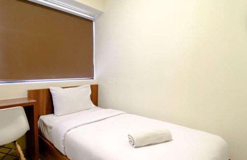 Cikarang Apartment | Homey 2BR with Work Space at Meikarta Apartment By Travelio