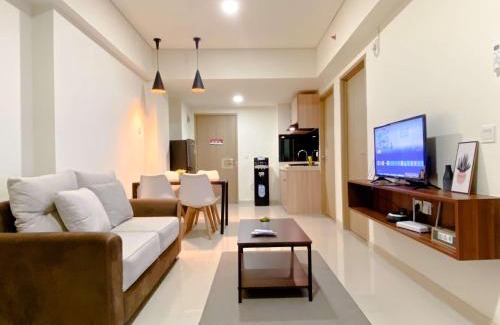 Cikarang Apartment | Homey 2BR with Work Space at Meikarta Apartment By Travelio