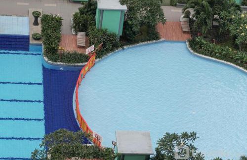Rawasari Apartment | Homey and Fresh 2BR Green Pramuka Apartment By Travelio