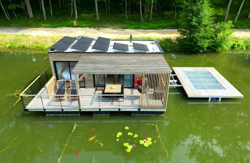 Sainte-Gemme Boat Rental | House Boat 'L'Othentique, Écolodge Flottant' with Lake View, Shared Garden and Air Conditioning